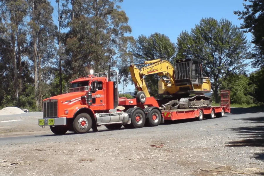 Excavator On A Truck Bed min