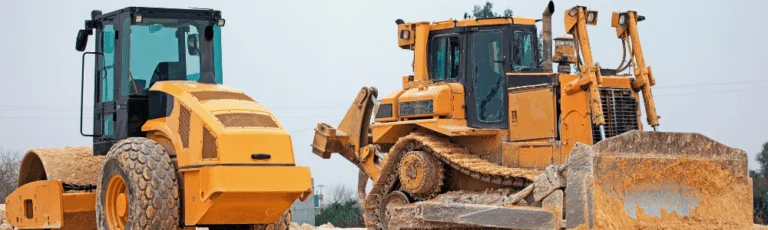 Two Yellow Construction Machines